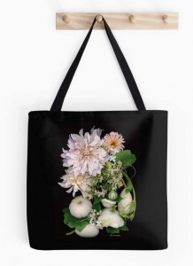 Dahlias printed on black canvas tote bags.