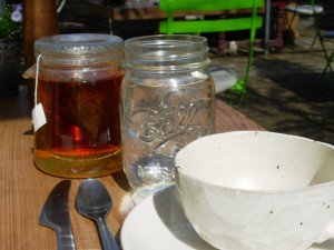 a morning. a mug of tea. breakfast inside a greenhouse. perfection.