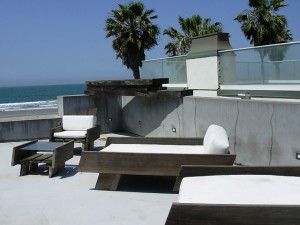 Lenny designed her chaises with distressed wood and modern lines - perfect for the rooftop garden