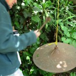 Tim Rudnick rings his hanging cymbal-as-doorbell
