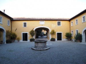 Talk about a "gravel courtyard" - this is the stunning entrance to La Foce's Casa and Tattoria