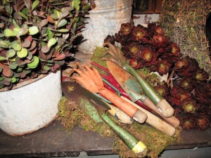 Vintage garden tools, displayed next to faux succulents