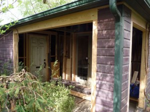 A work-in-progress photo, courtesy of Jon. This shot illustrates how the carpenter cut away the side of the garage to create a covered porch