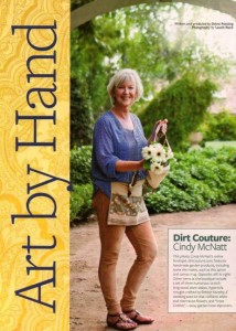Cindy McNatt, founder of the online boutique called Dirtcouture.com, posed for us in her Southern California garden. She's wearing a work apron and holding one of her canvas garden trugs.