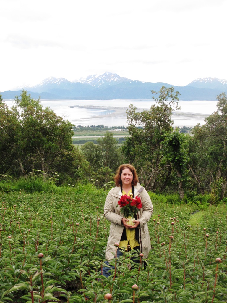 I'm standing in a Homer, Alaska, peony field at Scenic Place Peonies. It's owned by Beth Van Sandt and Kurt Weichhand - check out the views!!! 