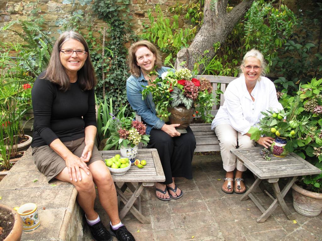 I'm sitting in the garden with my fellow designers, Mary Watson (left) and Victoria Summerley (right), as we show off our bouquets from this morning's sponteous floral session.