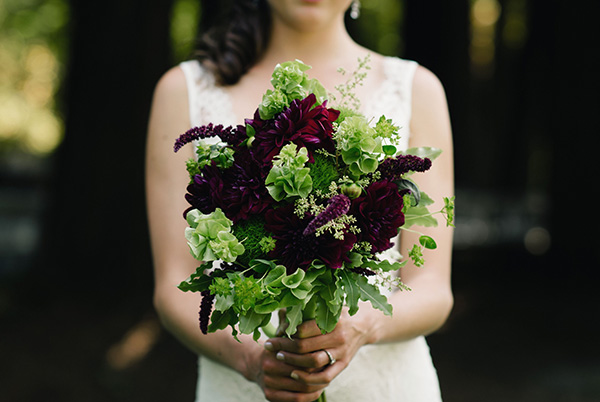 One of Gorgeous and Green's bridal bouquets in a sultry green and dark purple color scheme.