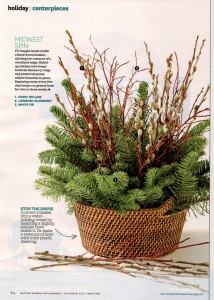 A Midwest-themed arrangement in a woven basket, with textural touches from twigs and pussywillow branches.