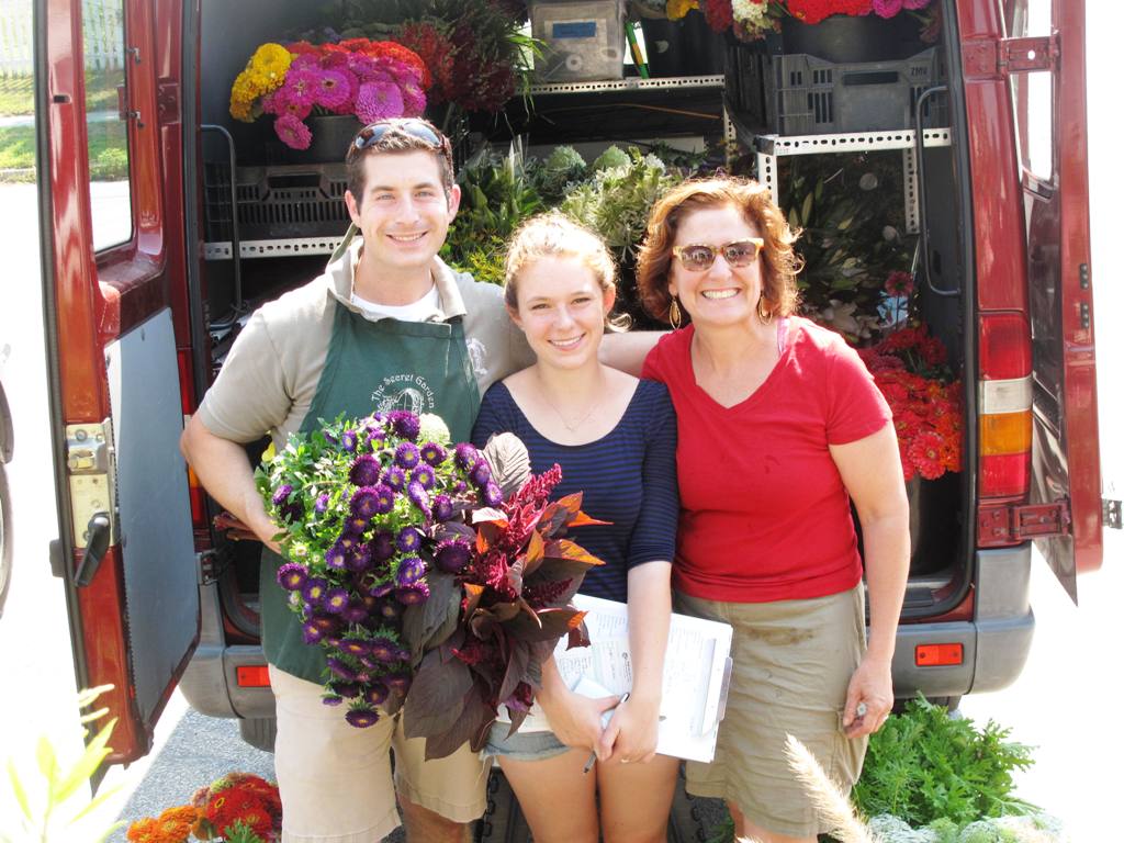 Polly Hutchison (right) of Robin Hollow Farm in Rhode Island makes weekly deliveries to David Urban (left), owner of The Secret Garden - an appreciative customer.