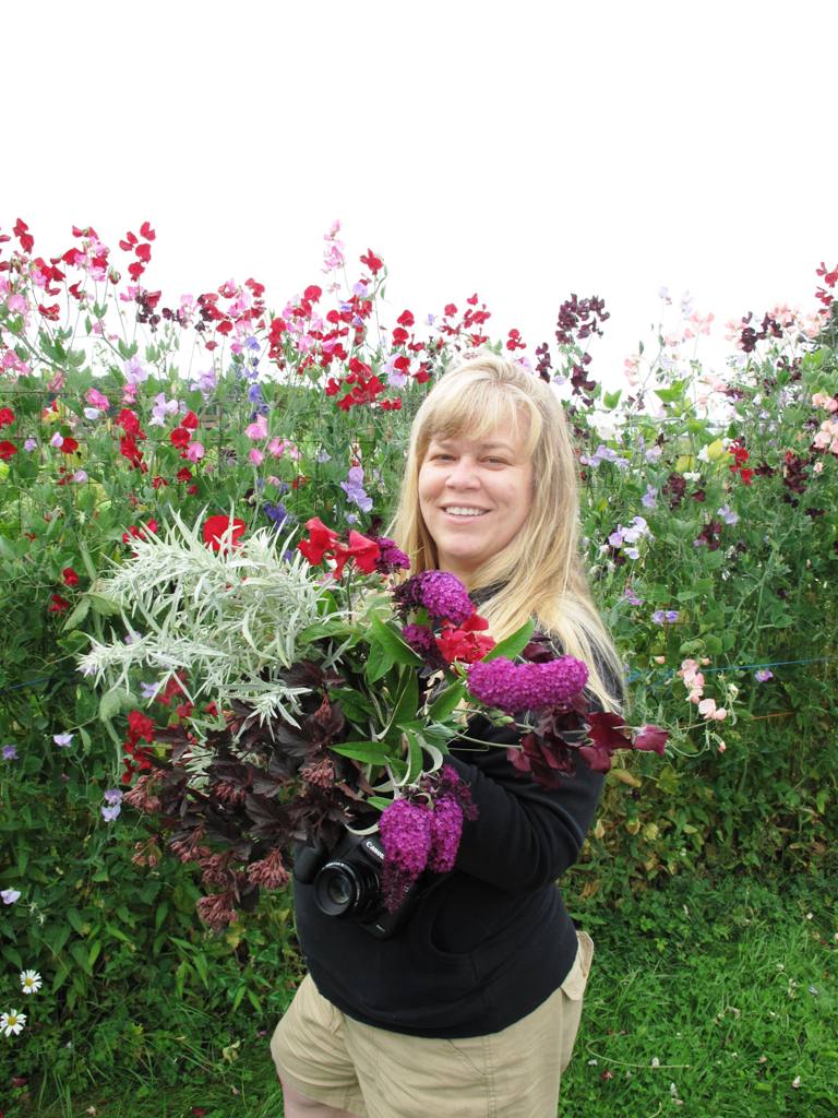 Alicia Schwede of Flirty Fleurs, going a little bloom-crazy during our early morning harvest.