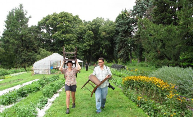 Lindsey (left) and Rob Cardillo (right), hauling chairs that we planned to use in a vignette of flowers. 