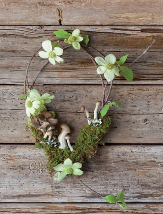 A wistful spring wreath uses flowering dogwood branches, sheet moss and earthy mushrooms.