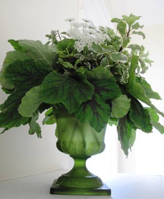 Love the shades, shapes and textures of green foliage in one of my favorite containers.