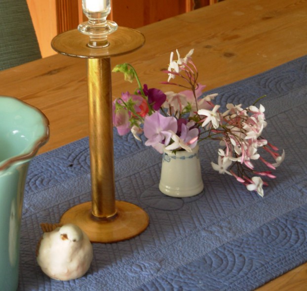 A diminutive bouquet, gathered from my former  Southern California garden and arranged in a tiny toothpick cup.