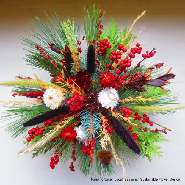 From Ann Sensenbrenner, owner of Farm to Vase in Madison, Wisconsin. This was her New Year's arrangement featuring conifers and evergreens, ilex berries, dried grasses, dried seed heads and dried flowers. 