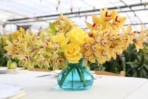 The signature design using cymbidiums grown byWestland Orchids and roses grown by Myriad Farms, two local flower farms.