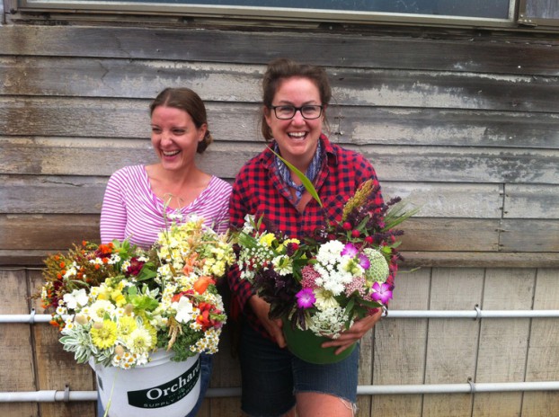 Betany Coffland (left) and Lennie Larkin (right). This photograph captured the friends holding flowers they grew for Chica Bloom Farm (Betany) and Petaluma Bounty (Lennie). 