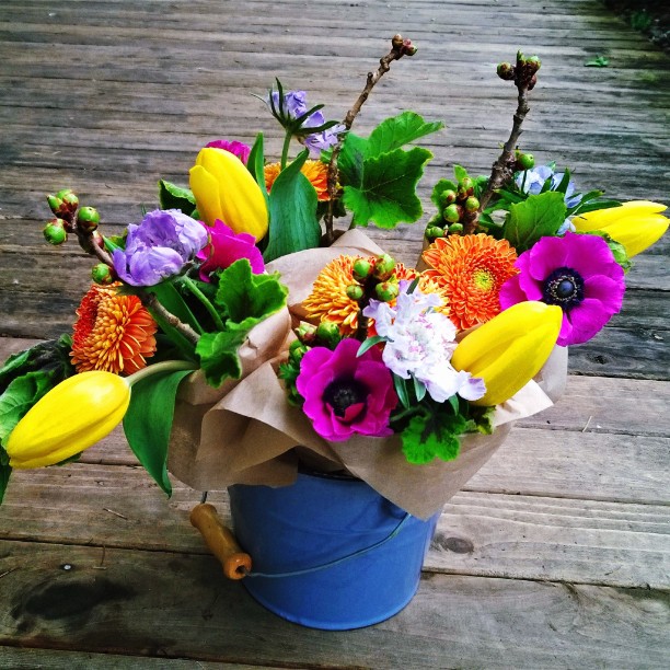 A vivid spring palette of wrapped bouquets by First & Bloom.