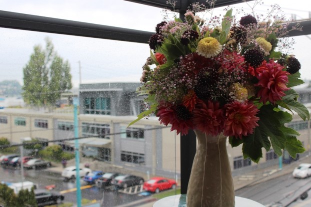 The view from my new urban balcony - a ceramic stool is the ideal pedestal for my summer bouquet