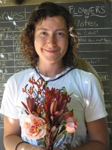 A 2015 Apprentice poses with her just-harvested, just-designed bouquet.