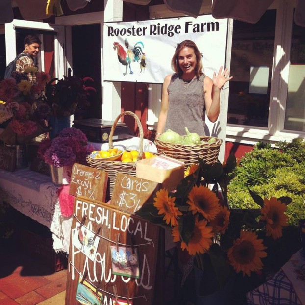 Haley staffs a Rooster Ridge pop-up stand in the community.