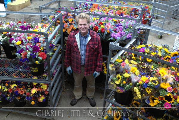 Charles Little with some of his favorite crops, ready to deliver to customers up and down the West Coast.