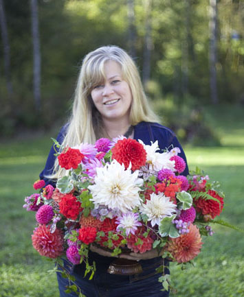 Alicia, with some of her favorite flowers, which she is now growing in her Washington State garden.