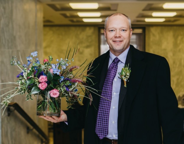 Does this look like a man who loves flower? Kasey Cronquist, CEO of the California Cut Flower Commission delivers another American-grown arrangement to the Caucus meetings.