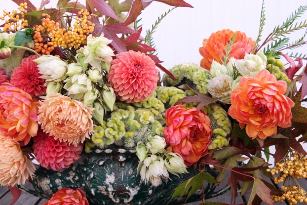 Lush, early autumn colors  of corals, peaches, ivories and celadon green.