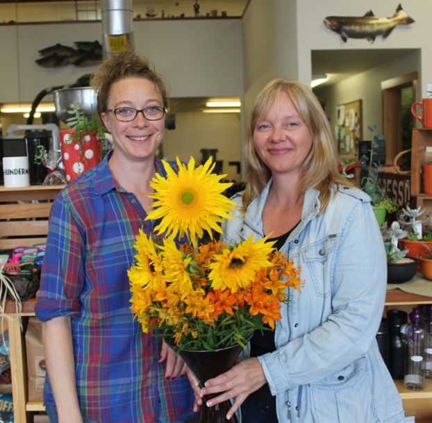 Kathleen (right) and her customer Carly, owner of 3 Cups Coffee in Astoria