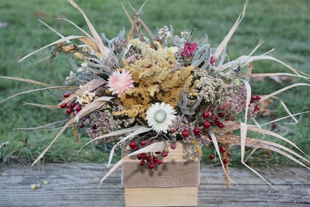 Radiate earthly elegance with dried flowers, grains, hips and grasses. Rebekah Mindel of Meadow Wilds Botanicals & Floral Design, gathered a pastel array of earthy colors -- tans and rouge, sage and cream -- in a dynamic textural centerpiece. 