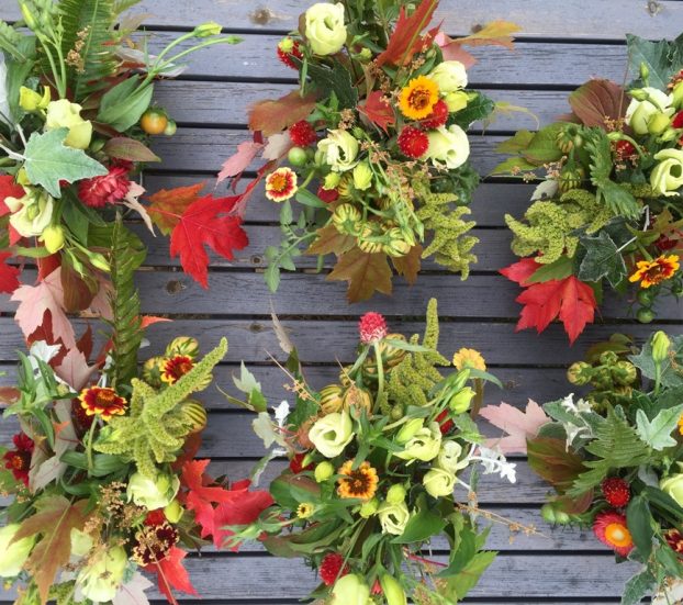 Add scarlet leaves and ornamental grains to convey autumn's rich palette. Hannah Morgan of Fortunate Orchard in Seattle, WA, tucked vibrant foliage from local maple, oak and liquidambar trees into seasonal centerpieces. 