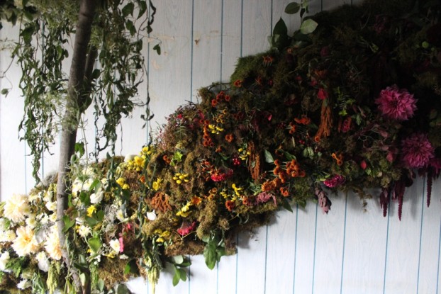 The walls of Susan and Caroline's "Foraged Floral"-themed bedroom are banded with wooshes of floral color.