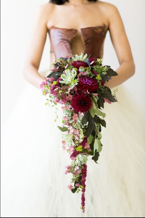 Holly made this bouquet using a European bouquet holder and glue techniques that she learned in a Francoise Weeks workshop. The design includes hanging red amaranths, succulents, lacey leaf hydrangea, burgundy ball dahlia buplerum, wild harvested foliage and sweet pea tendrils (c) First Comes Love Photography in Ann Arbor