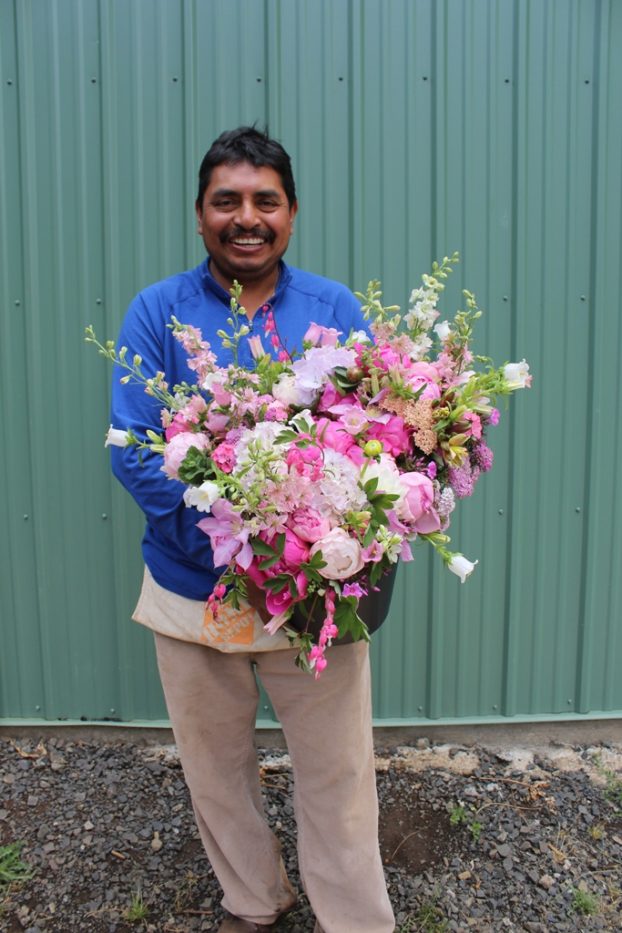 Gonzalo Ojeda with a bouquet he grew and designed.