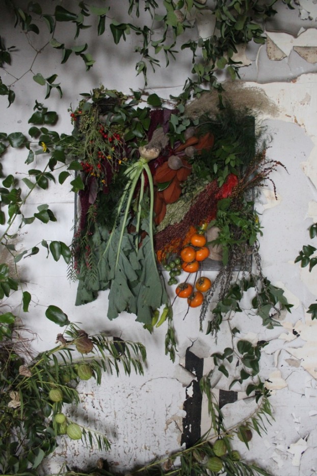 A bountiful moment appears on the wall of the downstairs kitchen, where Susan McLeary and Francoise Weeks incorporated vegetables grown by Cornman Farms.