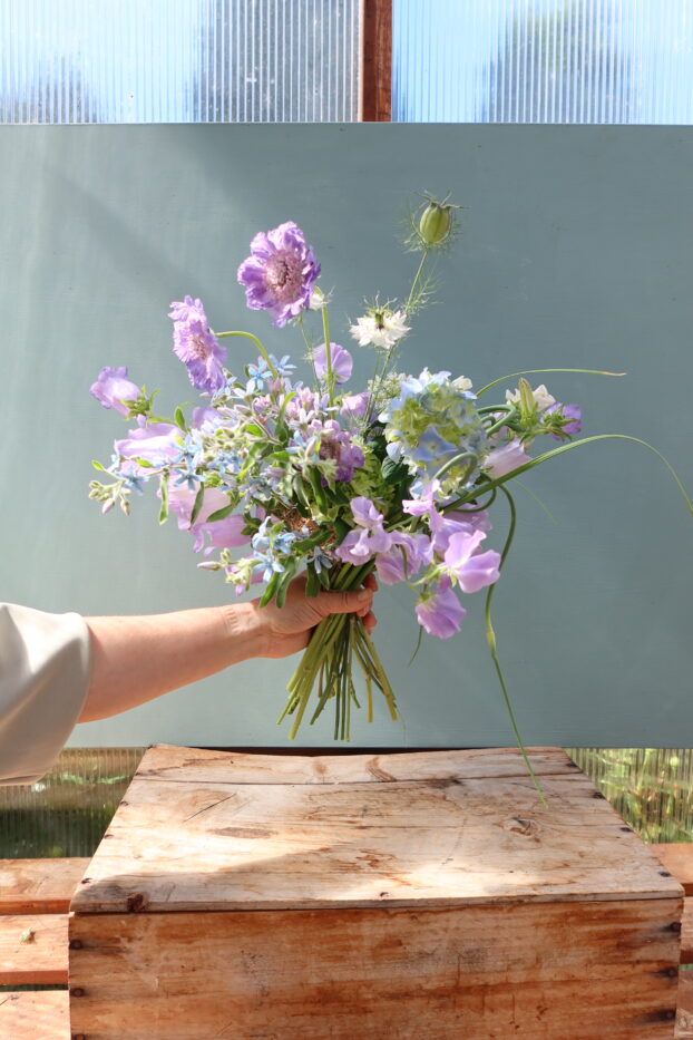 Seasonal bouquet using Spanish Moss-and-Raffia ball as mechanic