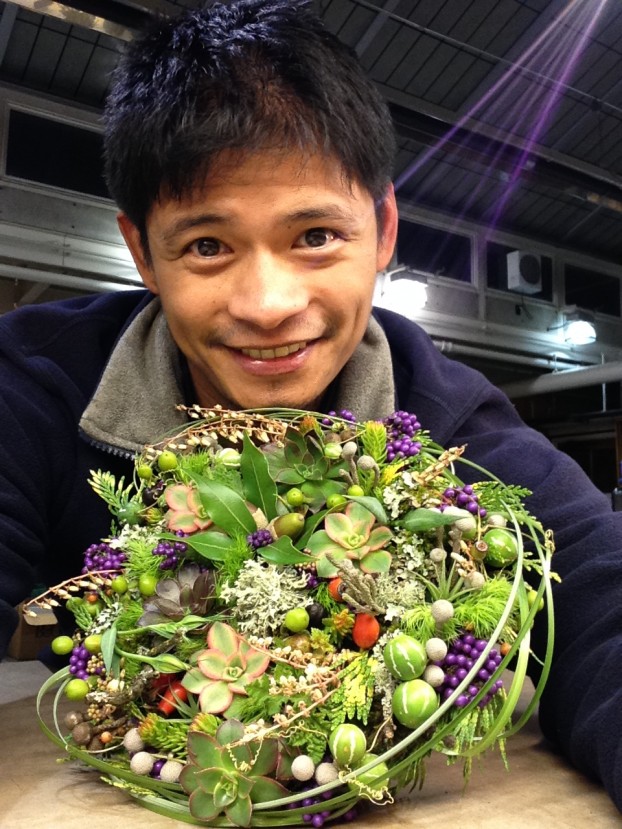 Riz with one of his highly detailed, textured, botanically-inspired bouquet