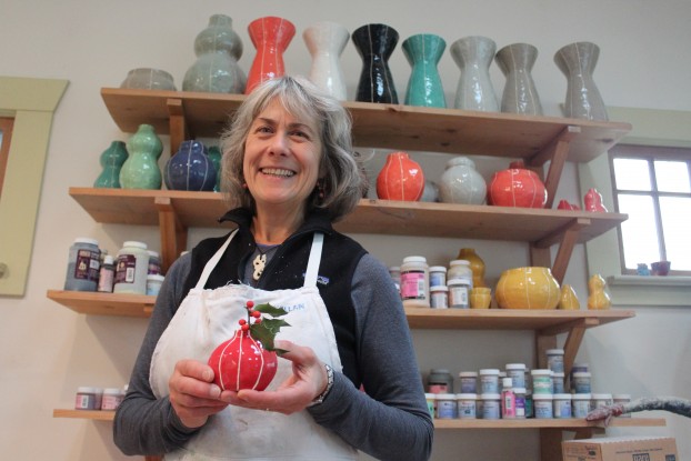 Kristin Nelson, American maker and ceramicist, poses with some of her beautiful vases.