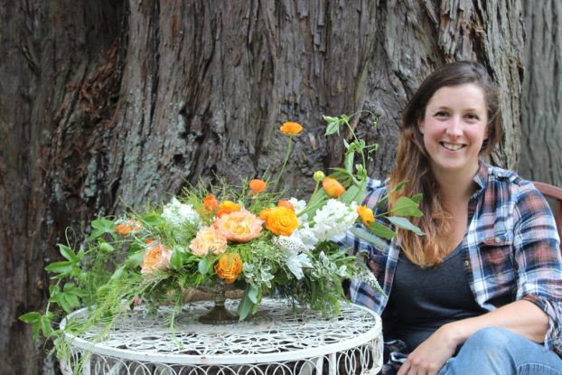 Laura Vollset with her beautiful arrangement in oranges, whites and greens.