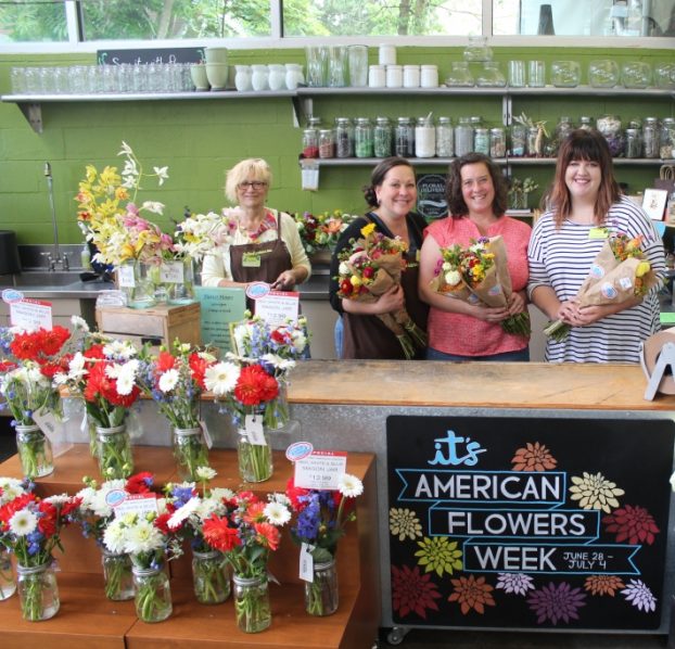New Seasons' floral manager Katie McConahay (right) with Bethany Little (second from right) and two of her team members at the Arbor Lodge neighborhood store in Portland.