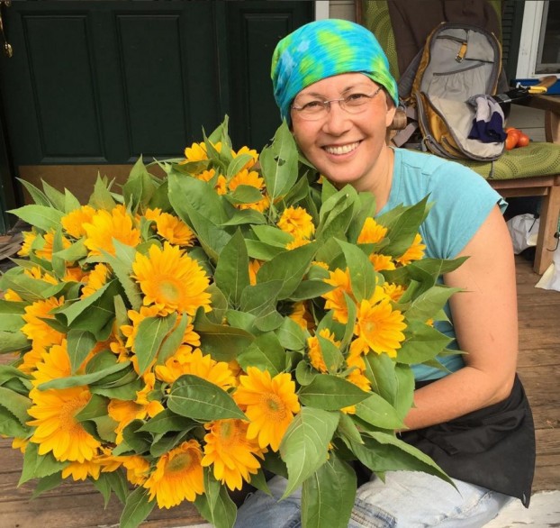 Pam poses with 'Vincent Fresh' ~ a favorite sunflower she grew last summer.