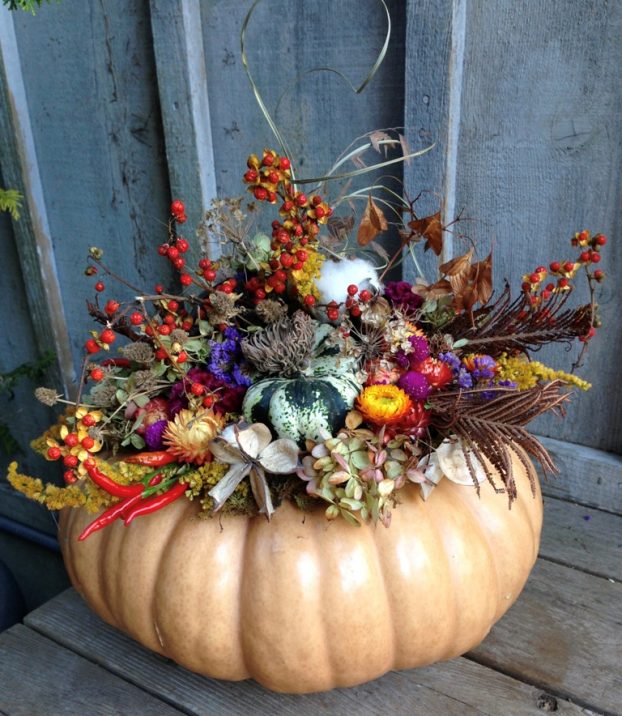 Decorate edible pumpkins with dried flowers. Jane Henderson of Commonwealth Farms in Concord, N.C., decorates pumpkins with foraged and dried flowers, feathers, seed heads and pods, creating a long-lasting harvest arrangement that is far easier than carving. 