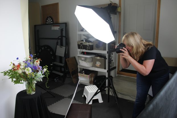 Kathleen in her studio where she operates her portrait photography business.