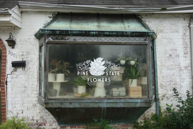 The 1930s building that was built to house Roll's Florist, is now home to Pine State Flowers