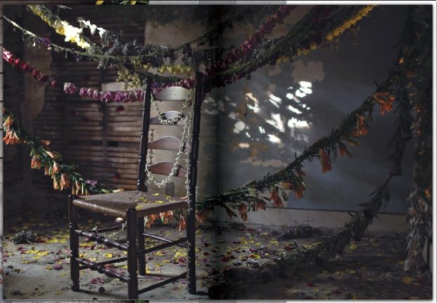 One of the most widely-published image from Heather's body of work: a chair found in the house was placed in the middle of a room for visitors to sit and enjoy swags of flowers hanging from above and the petal-covered floor, feeling as though they were in a FLOWERFALL, which is the title of this installation.